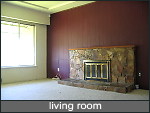 living room with wood burning fireplace